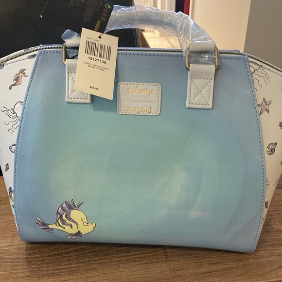 Ariel, sitting under moon satchel, lounge, fly purse - Picture 2 of 11